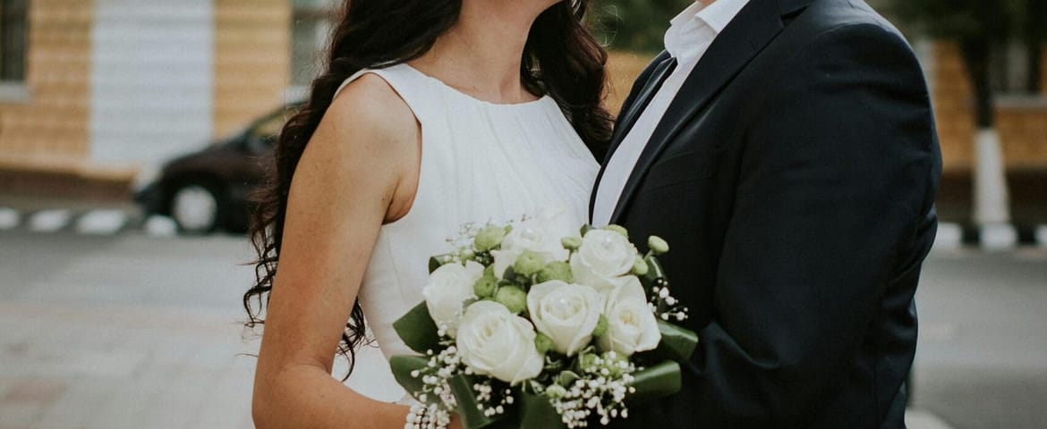 A joyful couple celebrating their wedding day in the charming streets of Jibert, Romania.